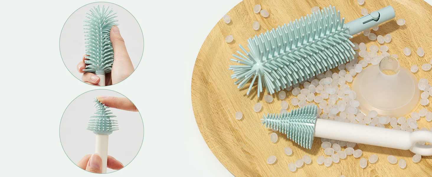 Pontas de escovas de silicone sobre uma base de madeira ao lado de uma chupeta transparente e grânulos de material.
