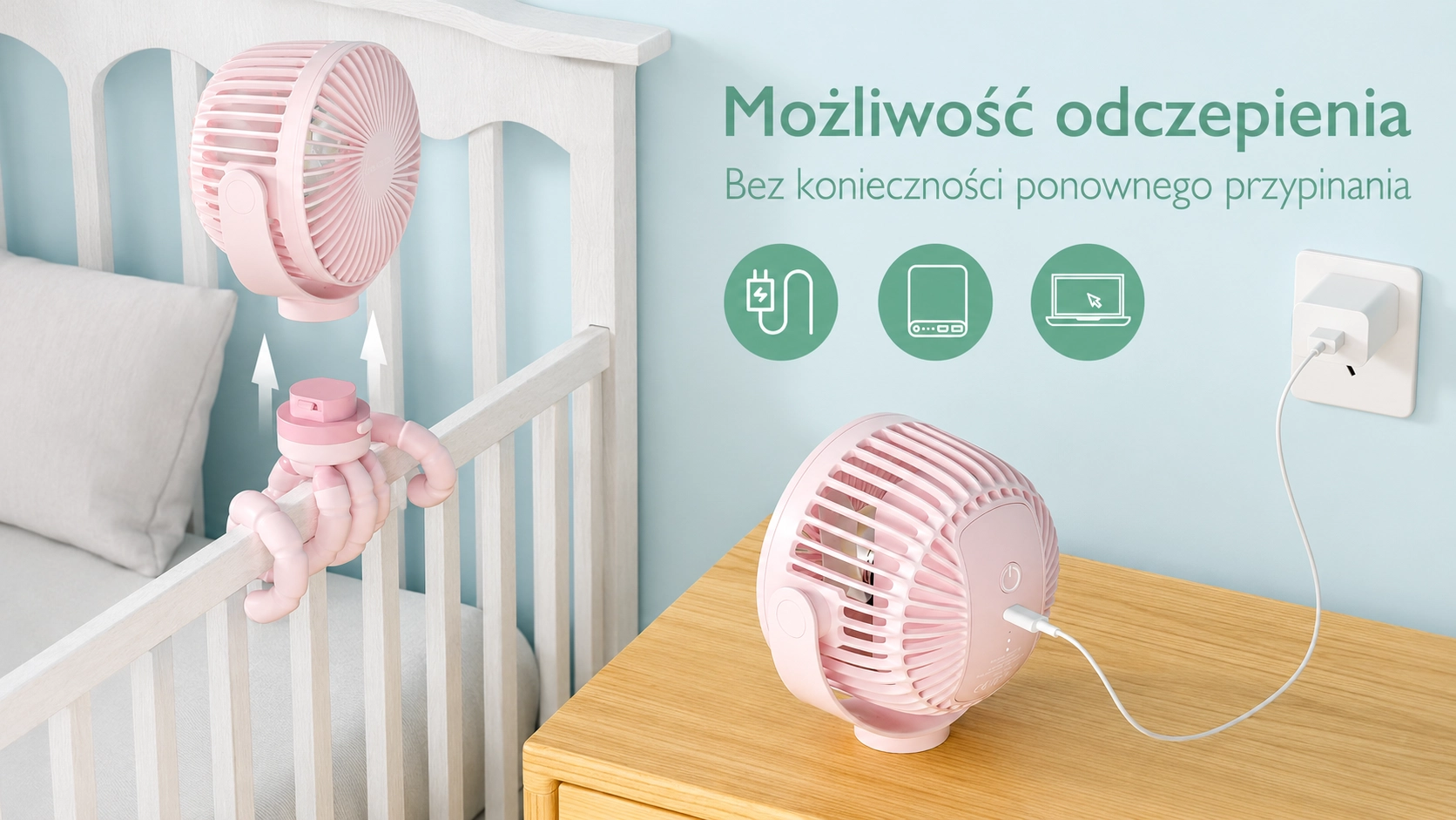 Pink Momcozy fan detached from the stand, wrapped around a bed, charged with a USB cable on a wooden chest of drawers