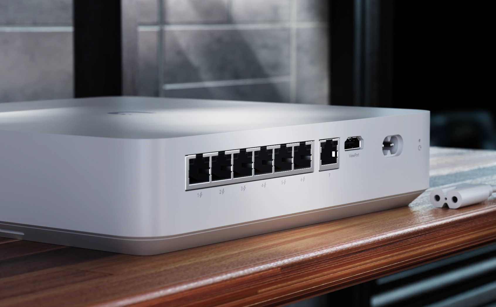 Vista lateral do Ubiquiti UNVR Instant, mostrando as portas de rede e o bot&atilde;o de alimenta&ccedil;&atilde;o na caixa