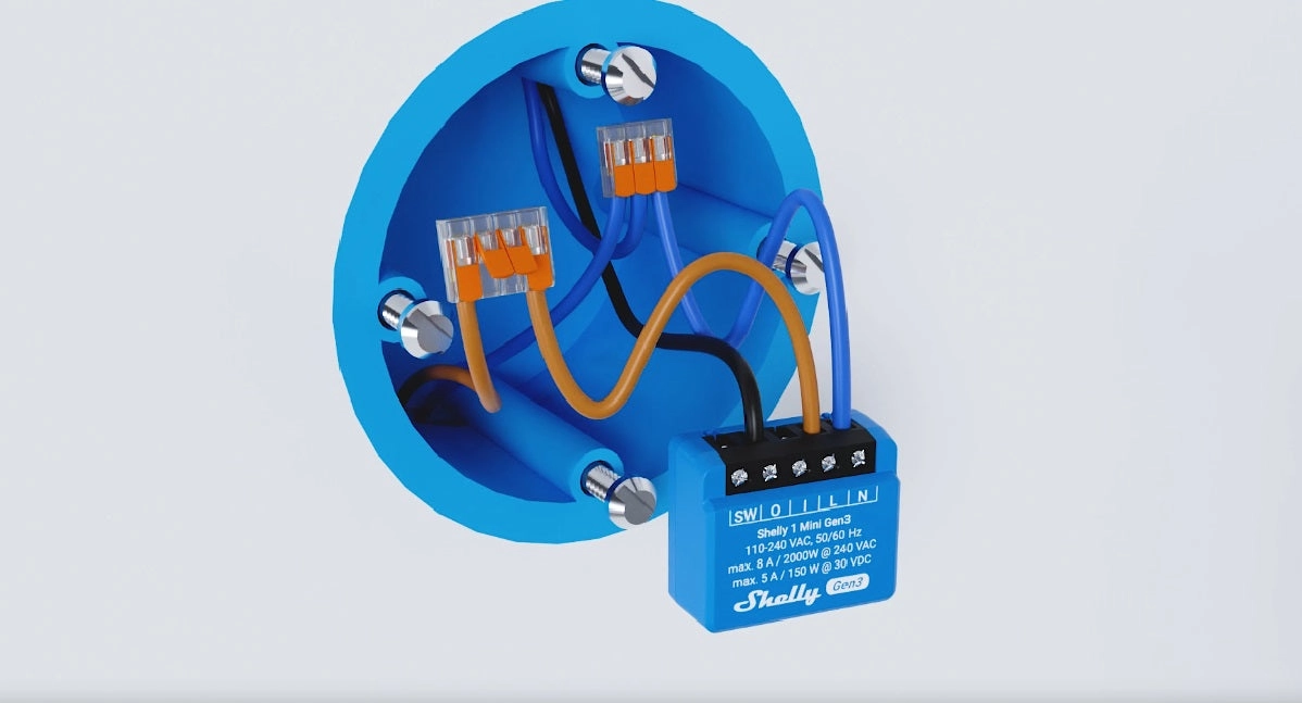 Moduł Shelly 1 Mini Gen3 zamontowany w skrzynce elektrycznej, podłączony do przewod&oacute;w