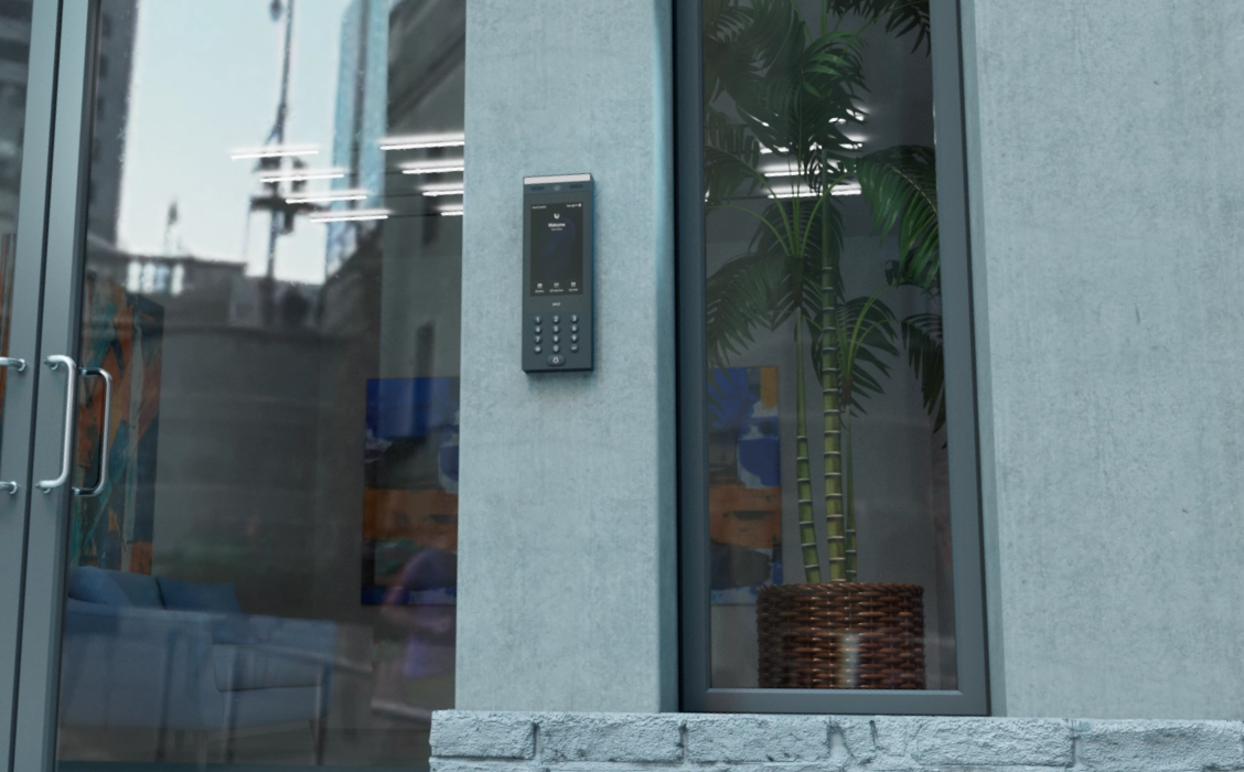 O intercomunicador Ubiquiti UA-G3, montado na parede, apresenta um ecrã com um teclado numérico e funções do dispositivo, com os detalhes do edifício visíveis em segundo plano