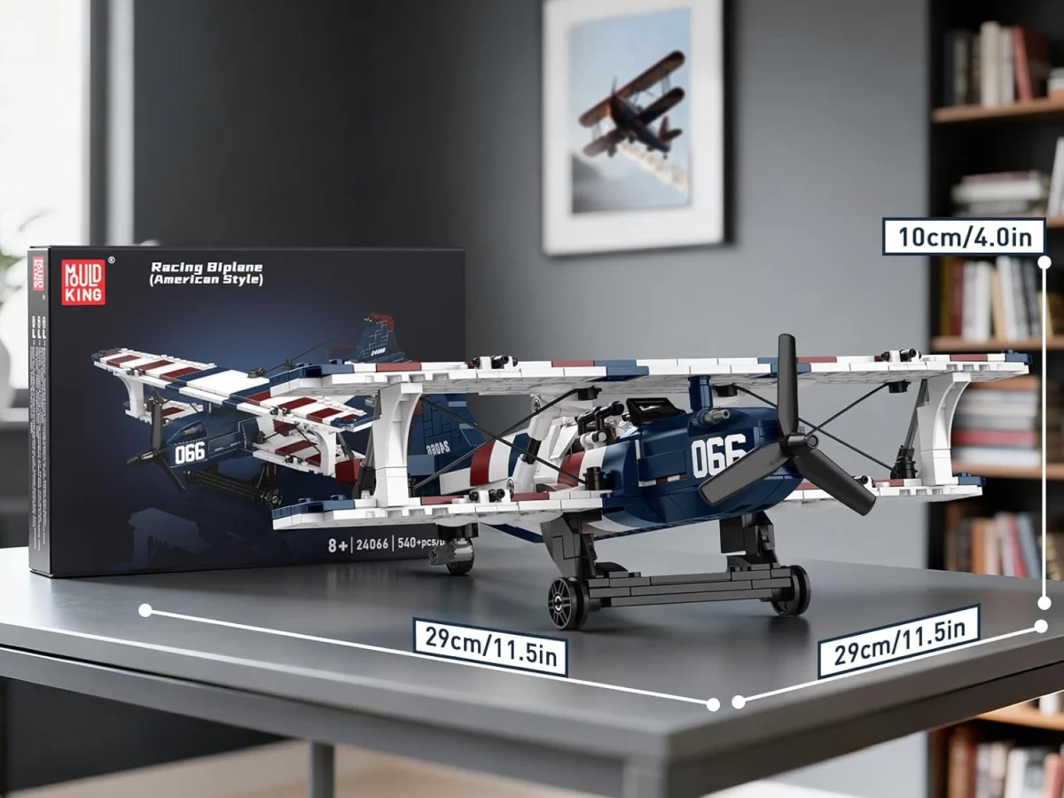 Modelo montado de avi&atilde;o biplano Mould King ao lado da caixa, com dimens&otilde;es assinaladas: 29 cm de comprimento e 10 cm de altura