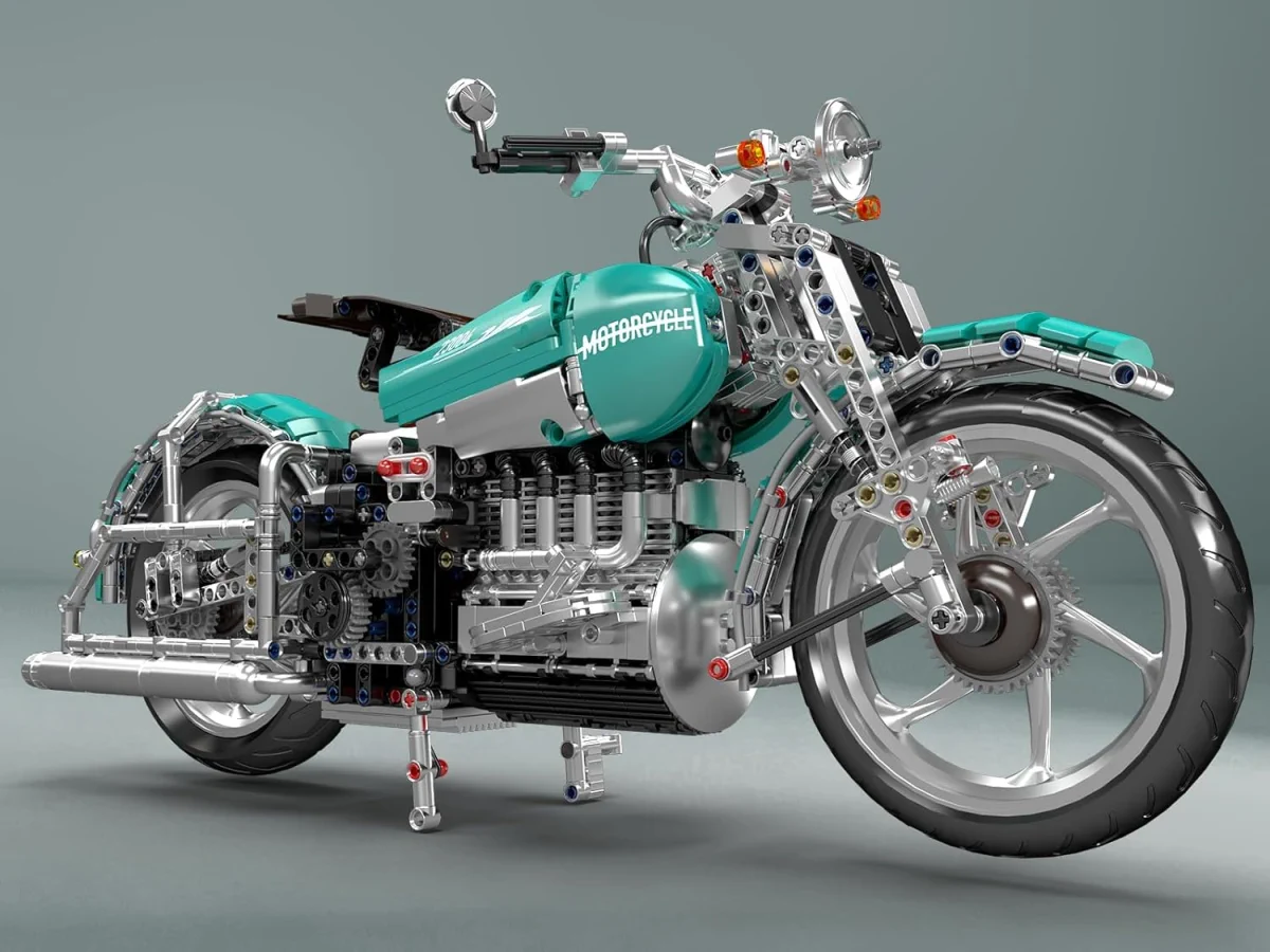 Close-up of the engine and front wheel details of a turquoise motorcycle made from blocks on a light grey background