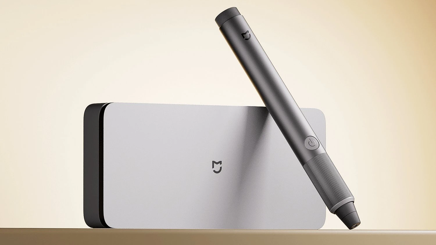 Srebrne etui i ciemnoszare narzędzie szlifierskie Xiaomi Mijia o smukłym kształcie przypominającym długopis