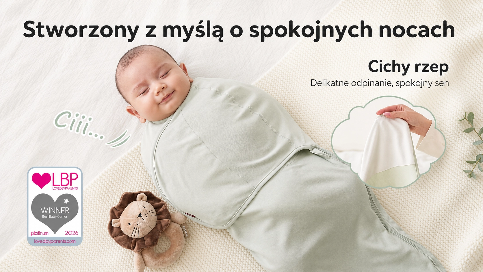 Beb&ecirc; dormindo em um enrolador menta com velcro silencioso. Ao lado, um le&atilde;o de pel&uacute;cia e o logotipo do pr&ecirc;mio LovedByParents 2026.