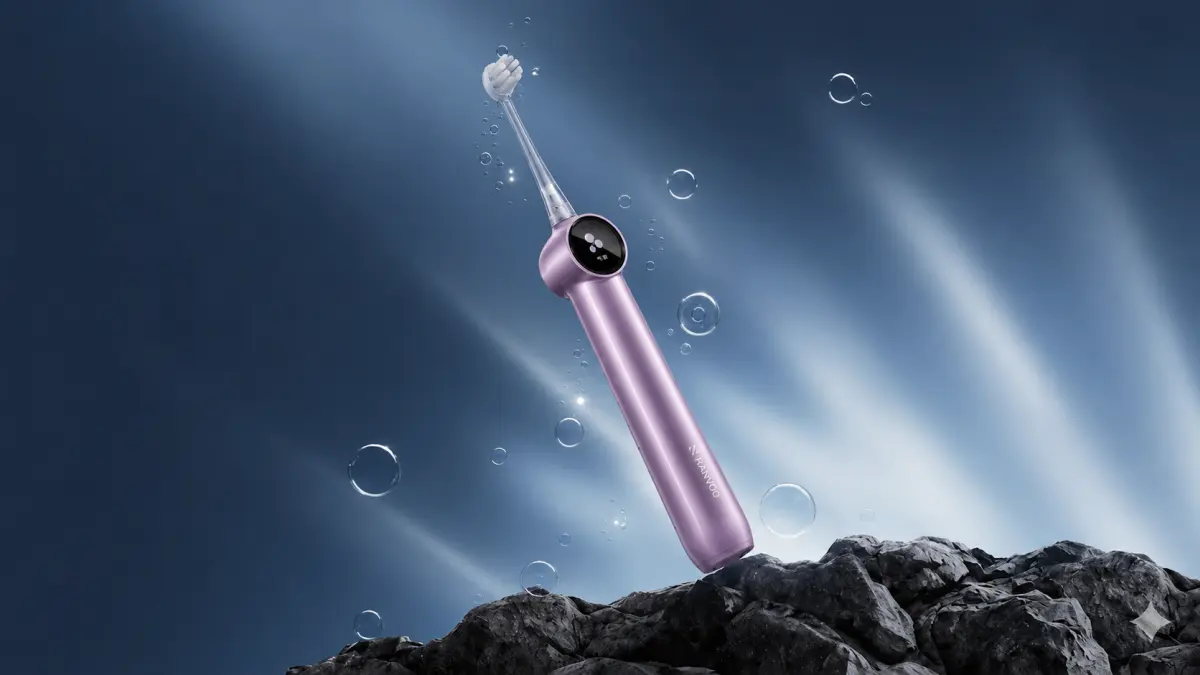 Lila RANVOO PH5 Bubble Schallzahnbürste vor Felsen, Bläschen und Lichtstreifen.